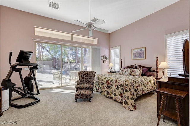 carpeted bedroom featuring ceiling fan and access to outside