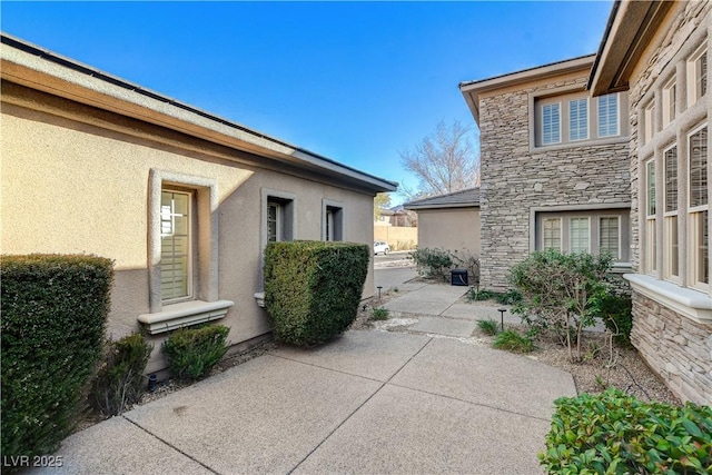 view of property exterior featuring a patio area