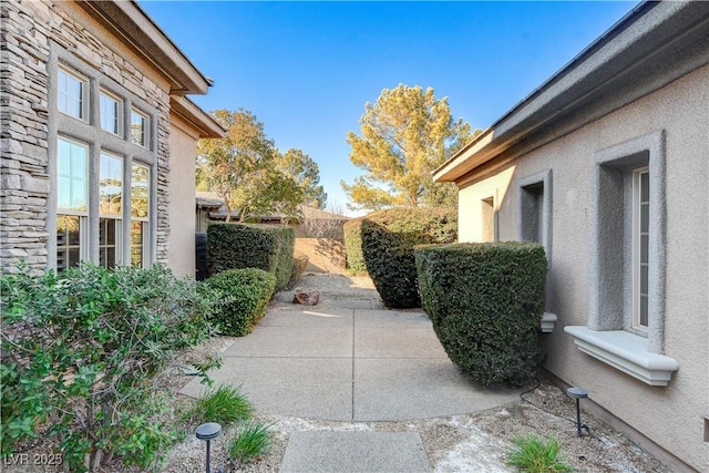 view of side of property featuring a patio