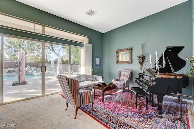 sitting room with carpet floors