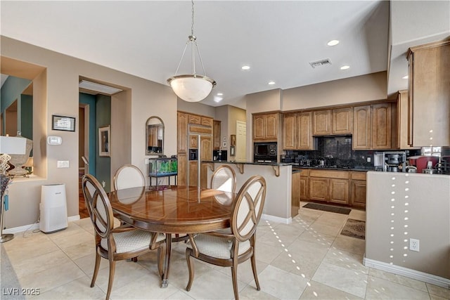 dining area featuring light tile patterned floors