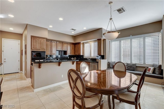 tiled dining room with sink