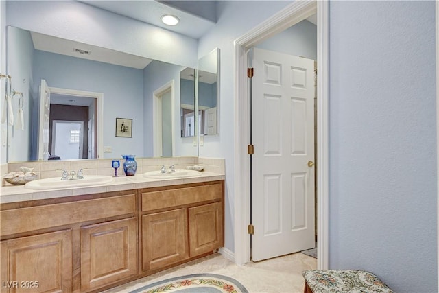 bathroom featuring decorative backsplash and vanity