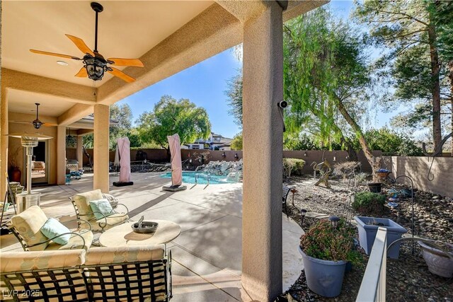 view of patio with a fenced in pool, ceiling fan, and an outdoor living space