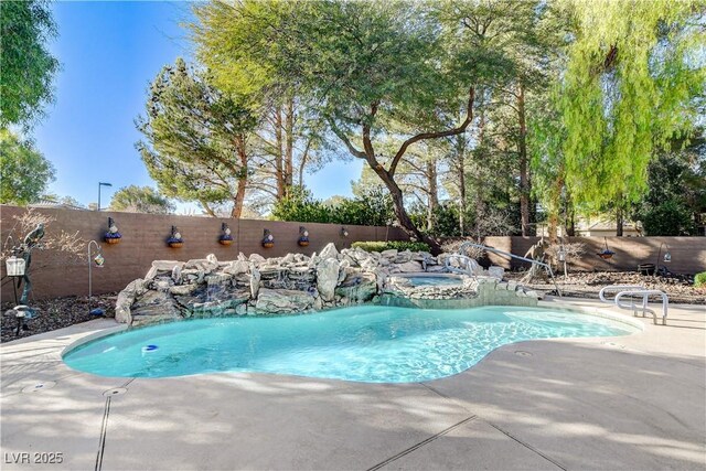 view of swimming pool with a patio area