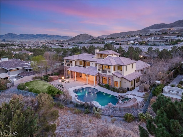 exterior space with a mountain view and a balcony