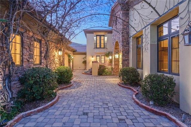 doorway to property with a patio area