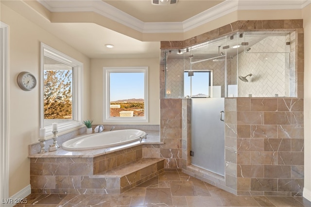 bathroom featuring ornamental molding and shower with separate bathtub