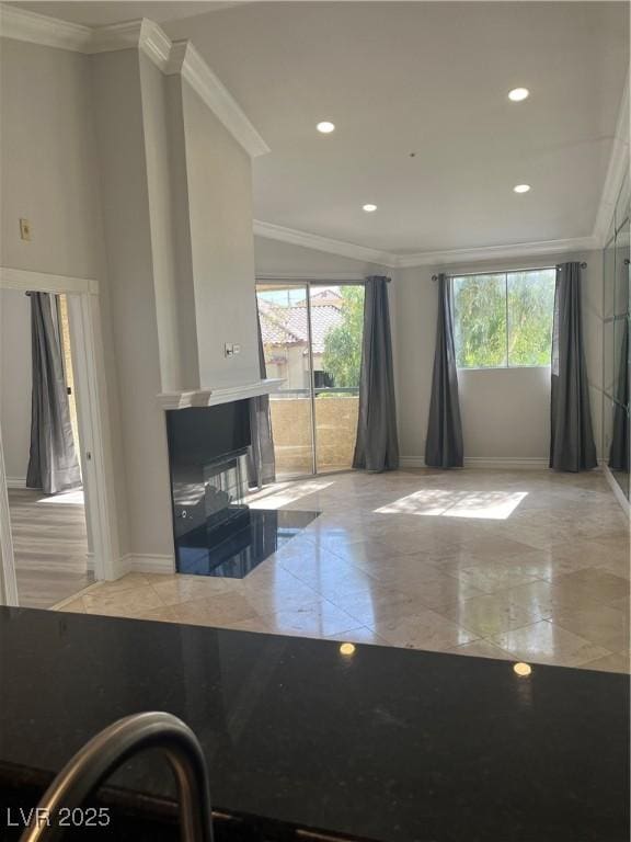 interior space with recessed lighting, baseboards, ornamental molding, and a multi sided fireplace