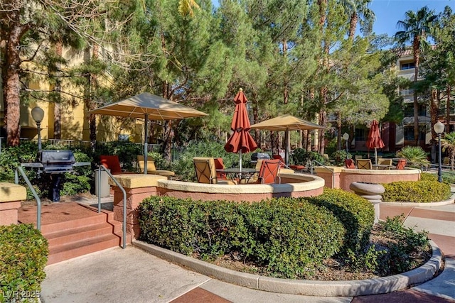 view of property's community with a patio area