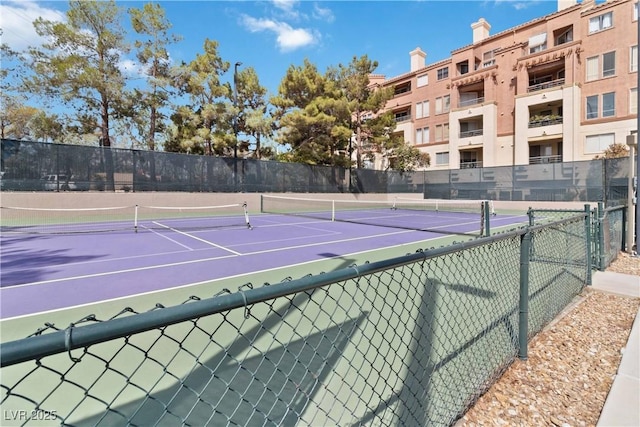 view of sport court with fence