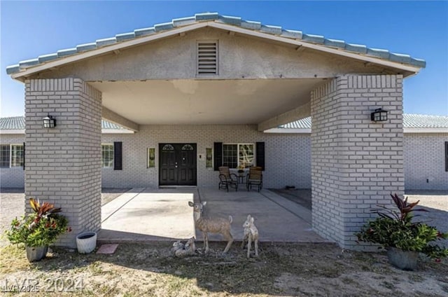 rear view of house with a patio