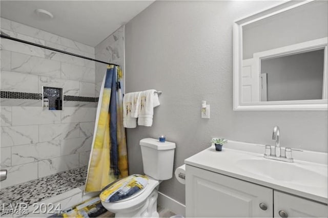 bathroom with a shower with curtain, vanity, and toilet