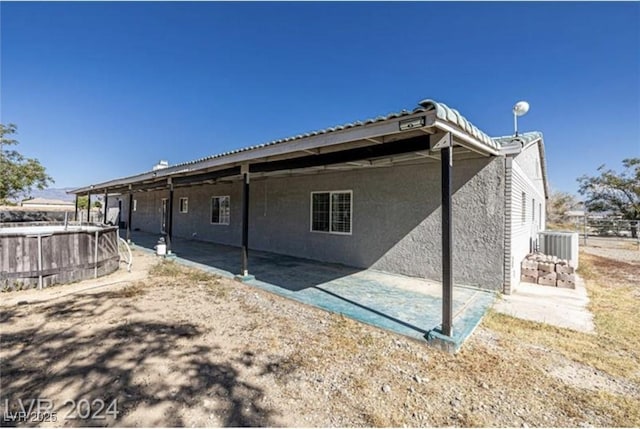 back of house with a patio