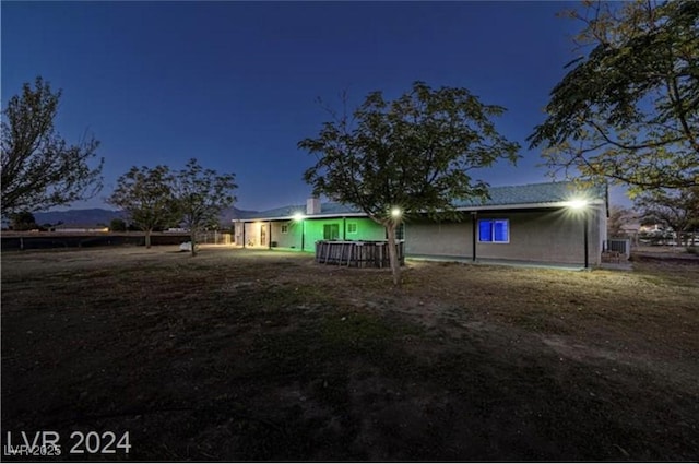 view of back house at night