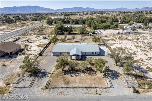 birds eye view of property with a mountain view