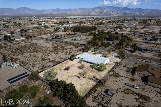 birds eye view of property with a mountain view