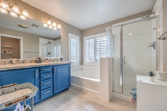 bathroom with independent shower and bath, tile patterned flooring, and vanity