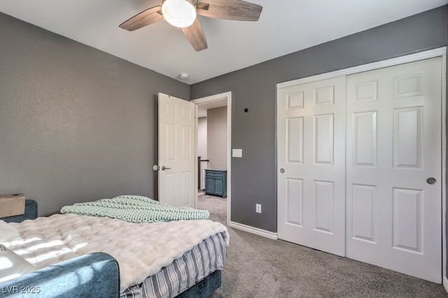 bedroom with ceiling fan, a closet, and carpet flooring