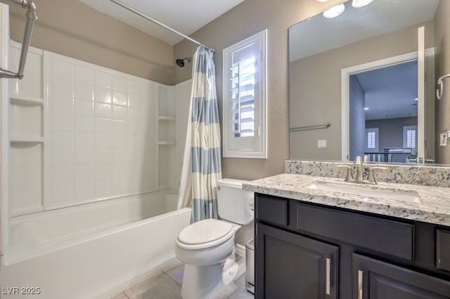 full bathroom featuring toilet, tile patterned floors, vanity, and shower / tub combo with curtain