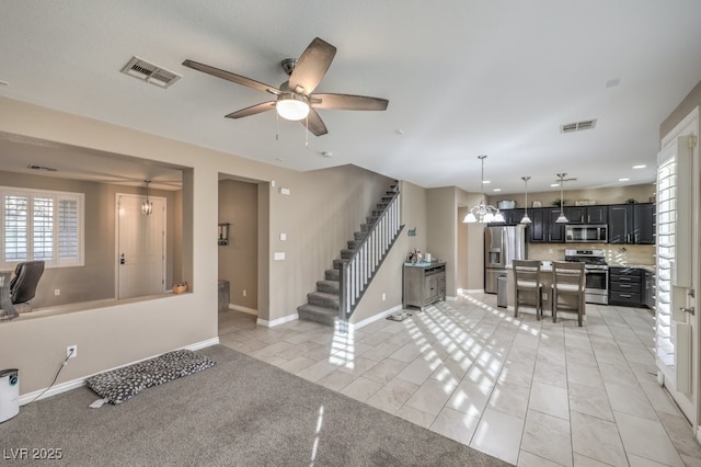 tiled foyer entrance with ceiling fan