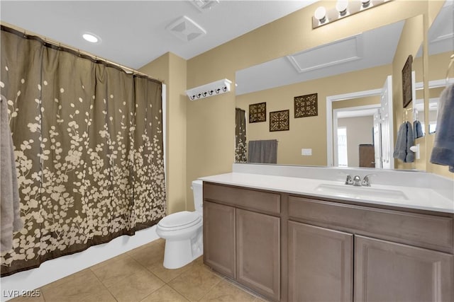 bathroom with tile patterned floors, toilet, and vanity