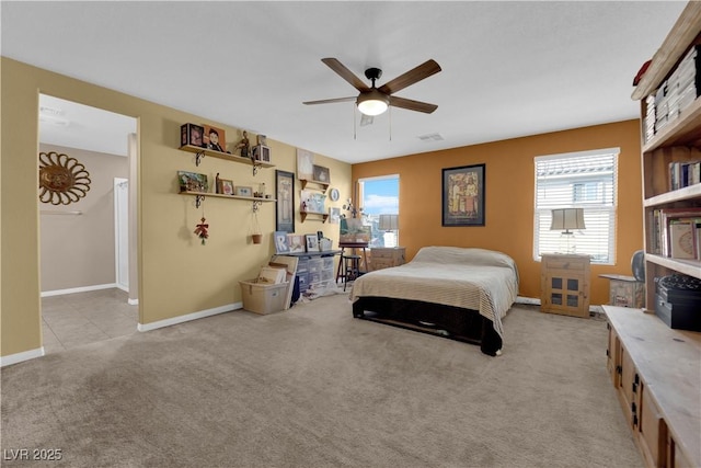 bedroom featuring light carpet and ceiling fan