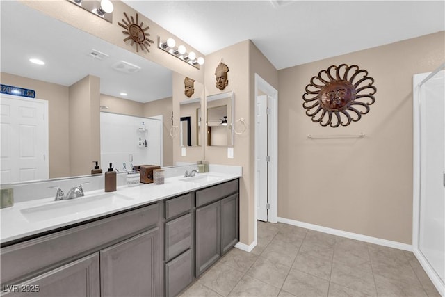 bathroom featuring vanity, tile patterned floors, and a shower with door