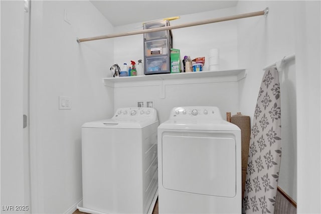 washroom featuring washing machine and dryer