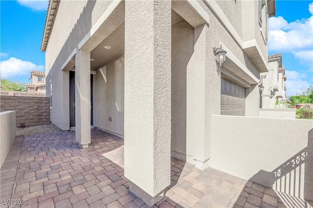 view of patio with a garage