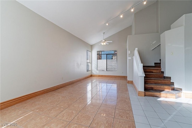 interior space with ceiling fan, light tile patterned floors, and high vaulted ceiling