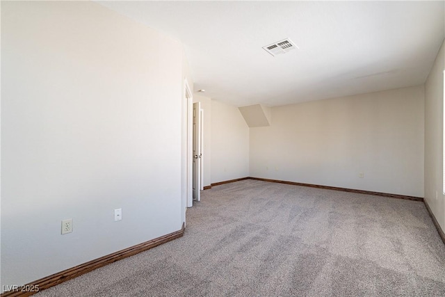 additional living space with light colored carpet