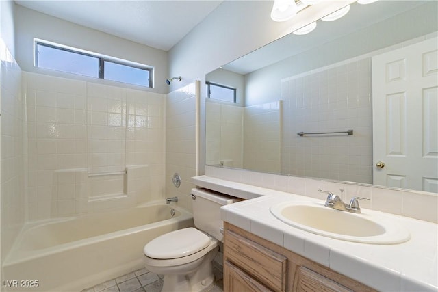 full bathroom featuring bathtub / shower combination, toilet, vanity, and tile patterned flooring