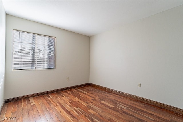 empty room with hardwood / wood-style floors