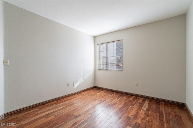 empty room featuring wood-type flooring