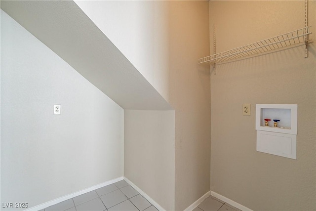 laundry area featuring washer hookup and tile patterned flooring