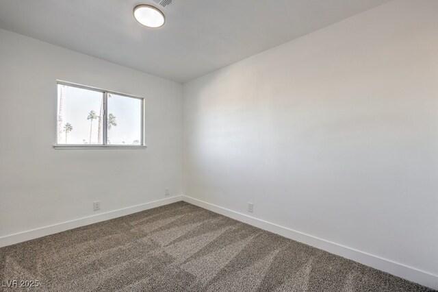 spare room featuring carpet flooring