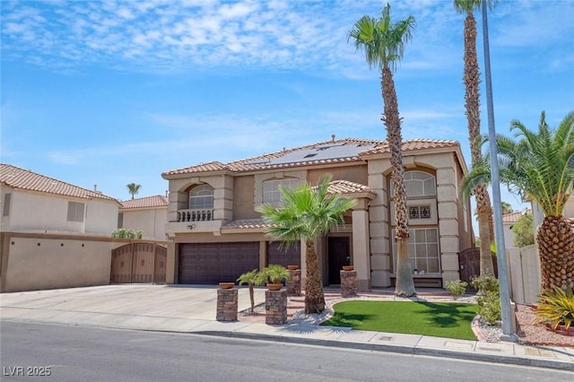 mediterranean / spanish home featuring a garage