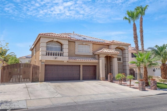 mediterranean / spanish-style house with a garage