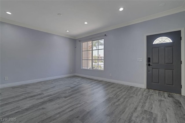 foyer entrance featuring light wood-type flooring and crown molding