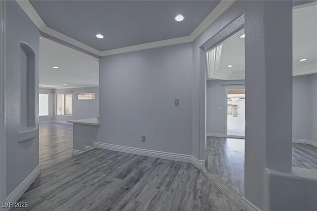 spare room with hardwood / wood-style flooring and ornamental molding