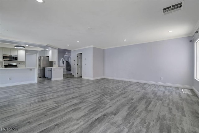 unfurnished living room with light hardwood / wood-style flooring and crown molding