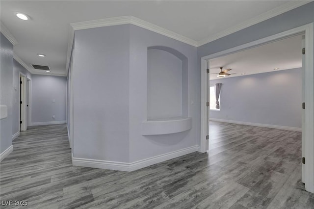 hall featuring crown molding and light hardwood / wood-style flooring