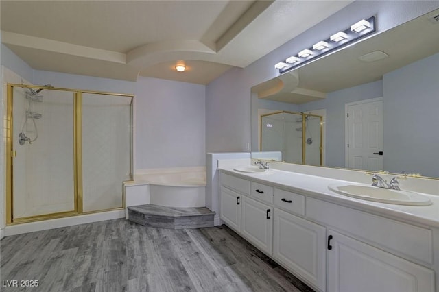 bathroom featuring separate shower and tub, vanity, and hardwood / wood-style flooring