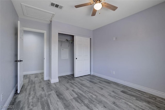 unfurnished bedroom with ceiling fan, a closet, and light wood-type flooring