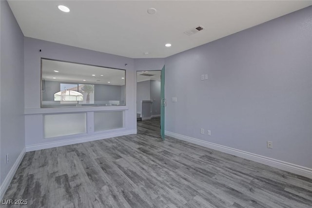 unfurnished living room with hardwood / wood-style floors