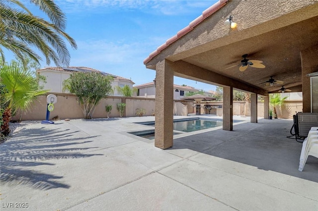 view of pool with a patio area and ceiling fan