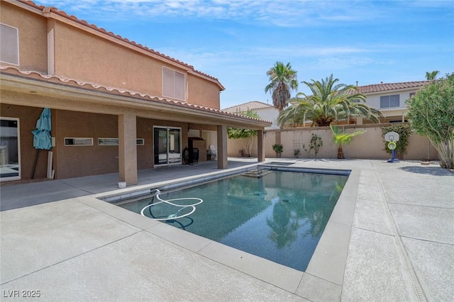 view of swimming pool featuring a patio area