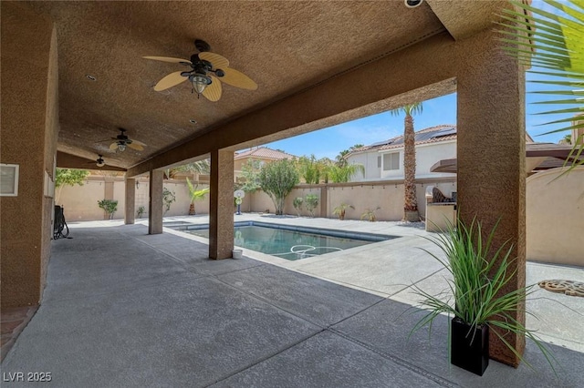 view of pool with ceiling fan and a patio