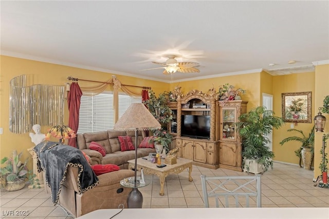 tiled living room with ceiling fan and crown molding